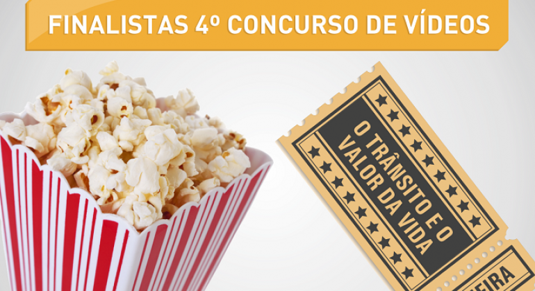 Concurso de vídeos O trânsito e o valor da vida Foto Balde de pipoca vermelho e branco, bem recheado com pipoca e ao lado um tiquetes de cinema escrito "O trânsito e o valor da vida!"